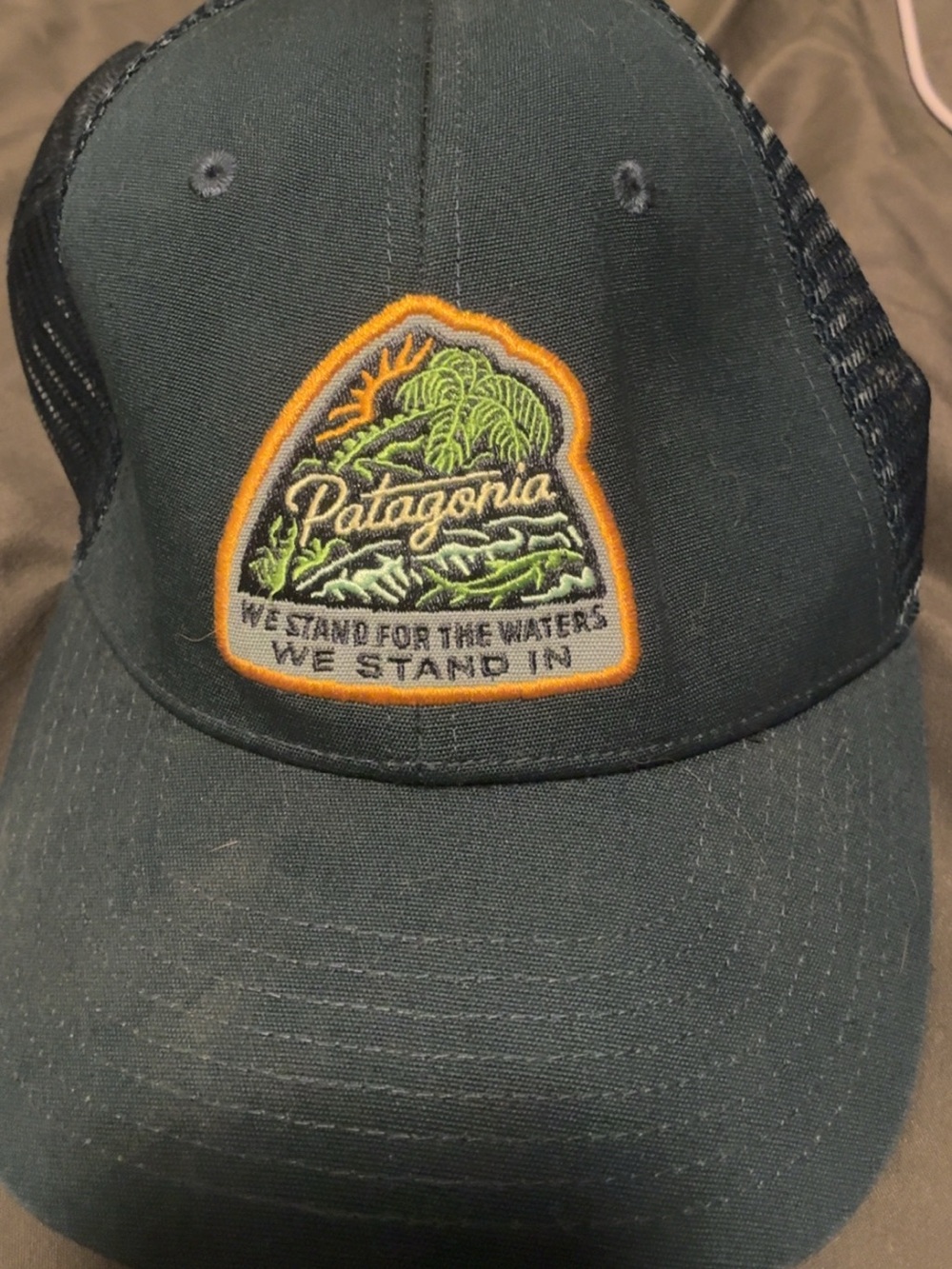 Patagonia Dark Green Trucker Hat with Orange-Trimmed Multicolor Patch